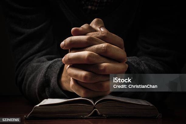 Praying Hands With Bible Stock Photo - Download Image Now - Praying, Church, Black Color