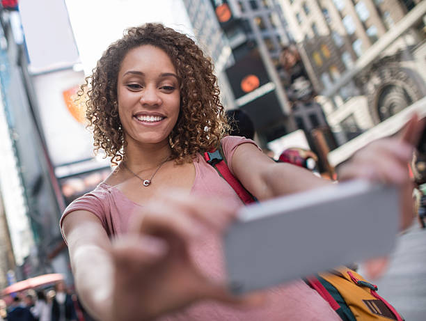 istock Woman taking a selfie at NYC 522403603