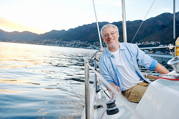 istock happy sailing man boat 522404035