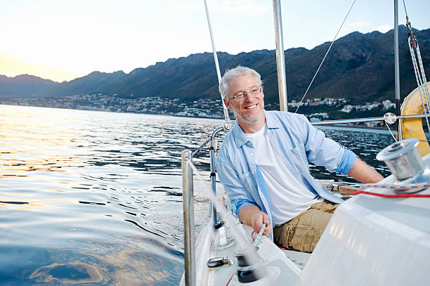 istock happy sailing man boat 522404037