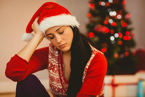 istock Festive brunette feeling sad at christmas 522404219