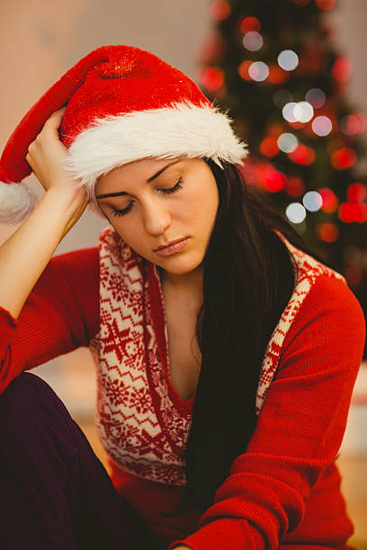 istock Festive brunette feeling sad at christmas 522404221