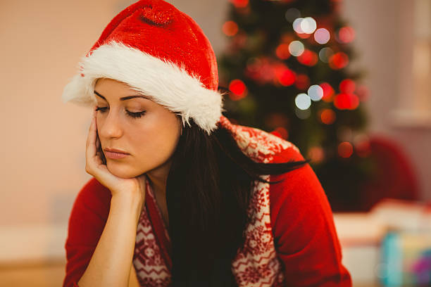 istock Festive brunette feeling sad at christmas 522404223