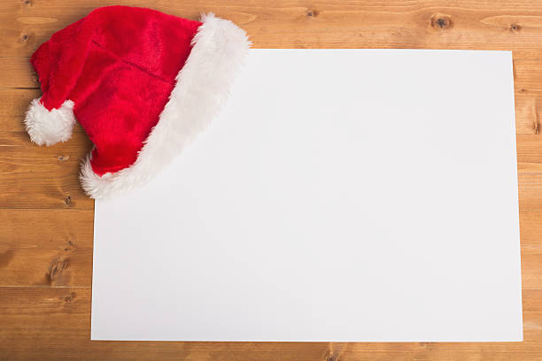 istock Santa hat on the corner of a white sheet 522404285