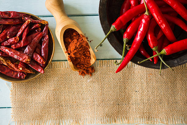 istock fresh and dried peppers and powder with copy space 522404409