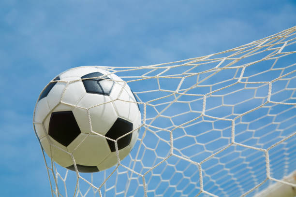 istock Soccer ball in the goal after shooted 522404577