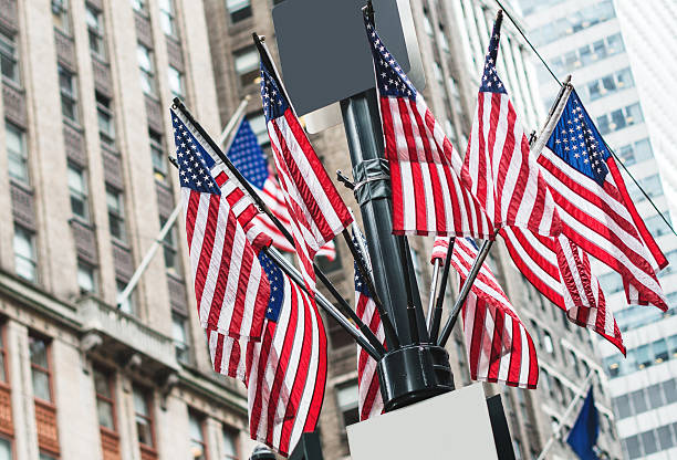 istock us flags waving on manhattan for a national holiday 522404751