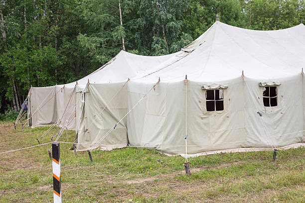 istock white big army tent in field 522418421