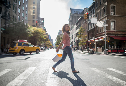 Woman shopping in NYC and walking on the street