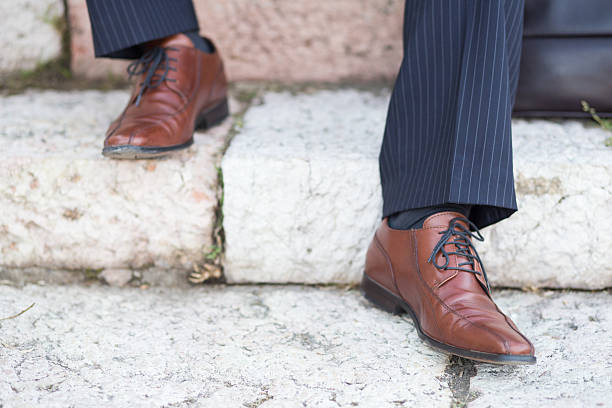 istock Businessman sitting on steps with his briefcase 522419055