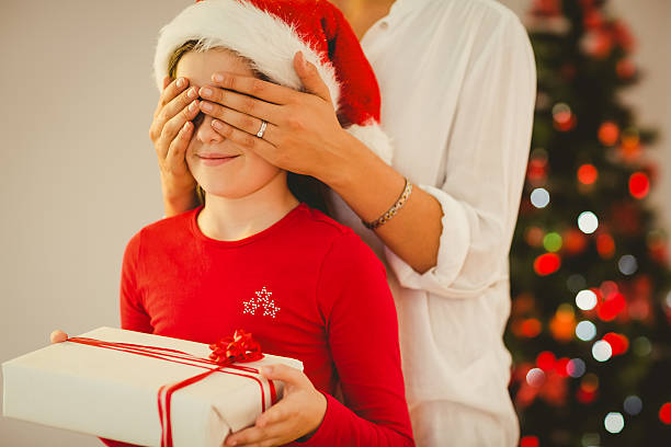 istock Mother surprising her daughter with christmas gift 522419227