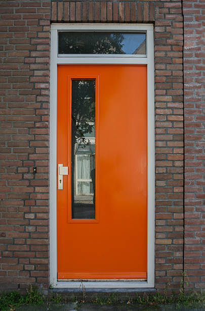 istock Orange Door on Brick House 522420155