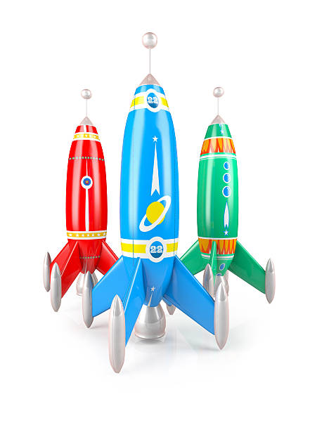 istock Three multi colored rockets, vintage metal missile toy 522423345