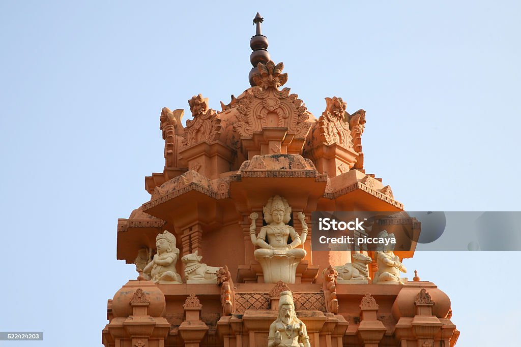 Roof temple in Kerala State, India Details of Temple in India against a blue sky. Kerala. India. Sri Meenakshi Hindu Temple Stock Photo