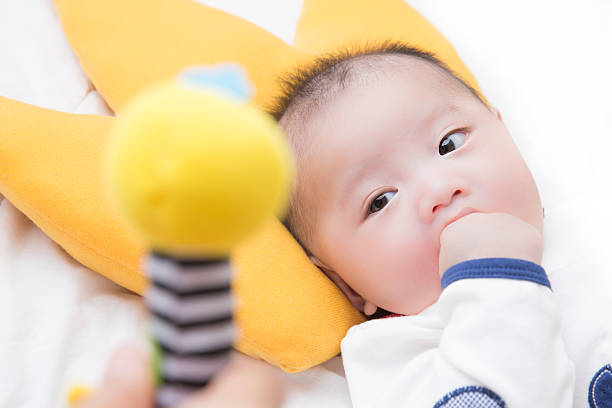 istock baby boy and a toy 522424727