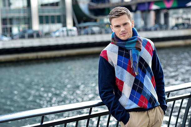 istock Handsome man posing near reiver railing 522435137