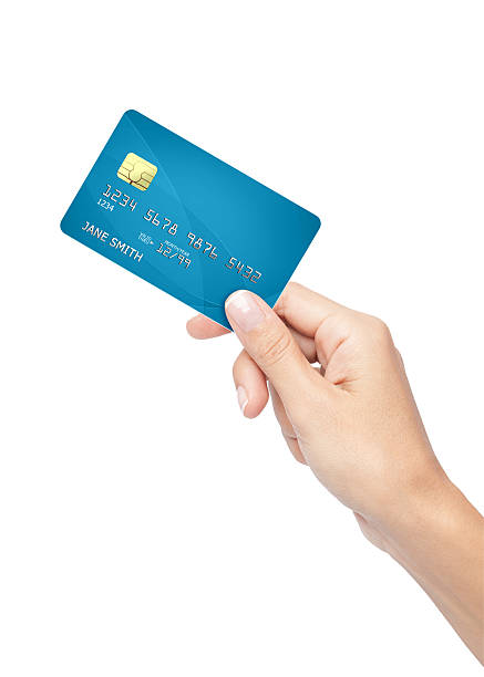 woman hand holding credit card woman holding, passing, giving a credit card on white background passing giving photos stock pictures, royalty-free photos & images