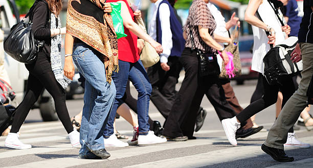 istock Pedestrian crowd crossing street 522436627