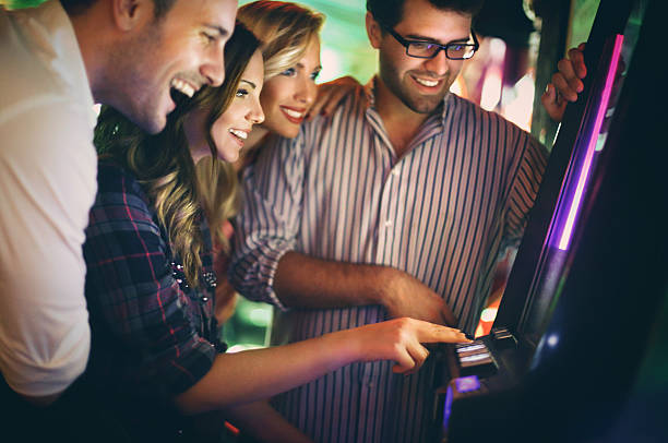 istock Group of young adults having fun in casino. 522437325