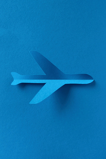 Airplane abstract blue paper cut silhouette background