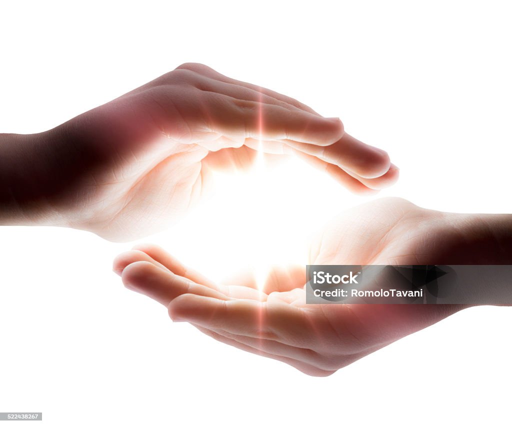 light in hands faith concept - blowing from hands Sunbeam Stock Photo