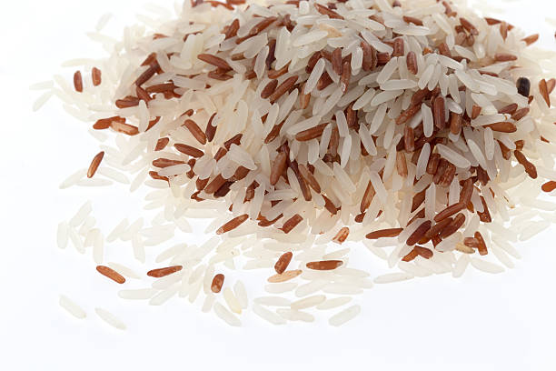 istock Handful of mix grain rice (macro shot) 522438365