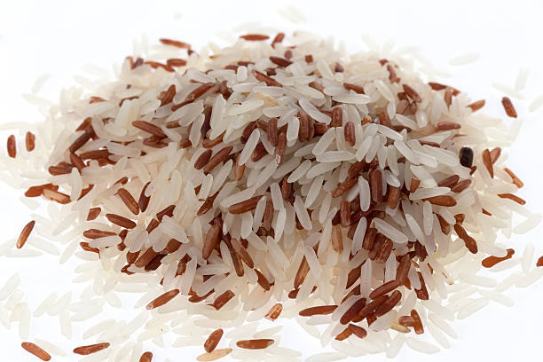 istock Handful of mix grain rice (macro shot) 522438367