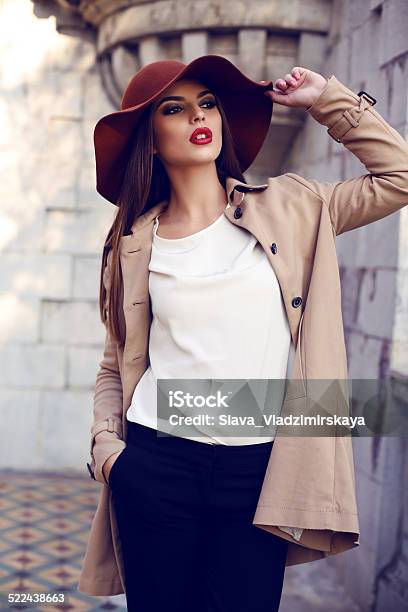 Beautiful Ladylike Woman In Elegant Clothes Posing In Autumn Park Stock Photo - Download Image Now