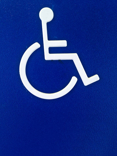 istock Disability person symbol on blue metal sheet 522438797