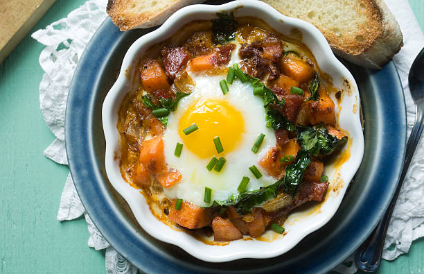 Baked Egg with Sweet Potatoes and Toast stock photo