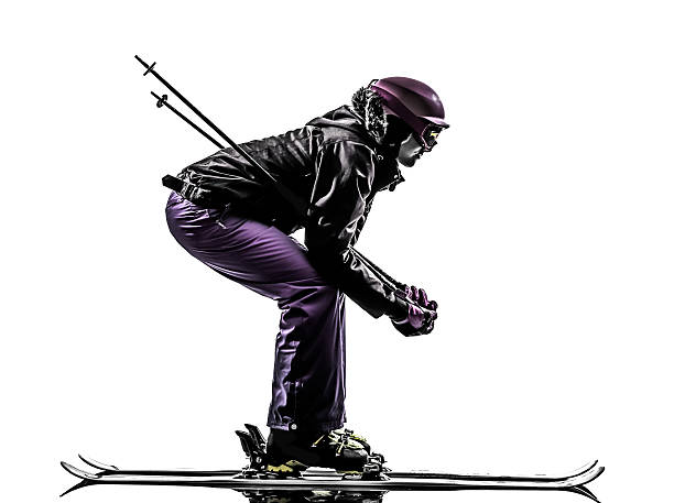 one  woman skier skiing in silhouette on white background