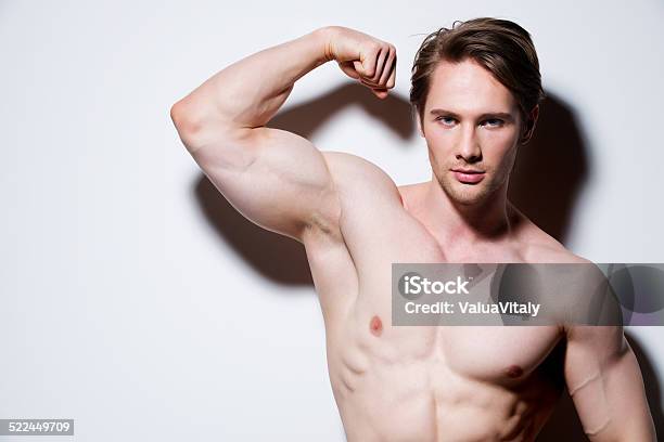 Portrait Of A Sexy Muscular Young Man Stock Photo - Download Image Now - Adult, Adults Only, Anaerobic Exercise