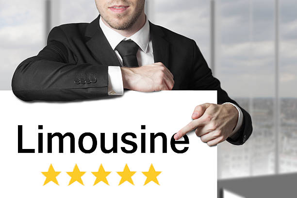 istock businessman pointing on sign limousine five stars 522452067