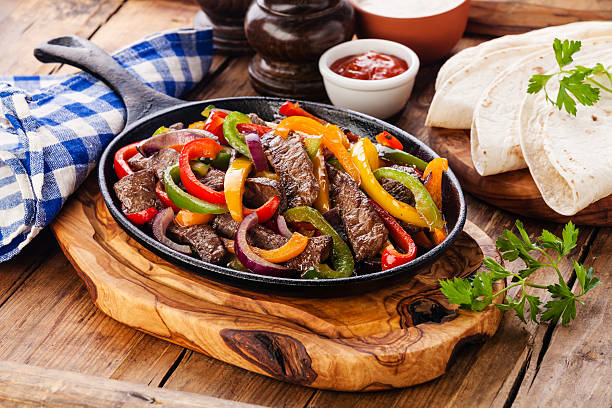 istock Beef Fajitas, tortilla bread and sauces 522452178