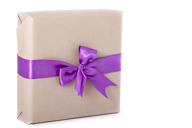 Gift with a purple ribbon stock photo