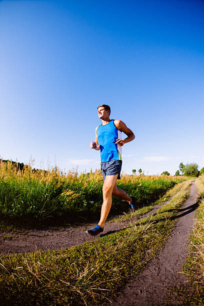 istock Young man running outdoors 522454429