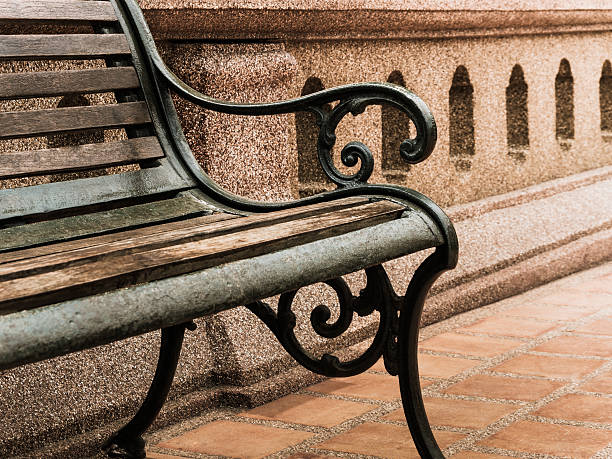 Closeup empty vintage bench in front of old rugged wall, Hi Contrast Filter