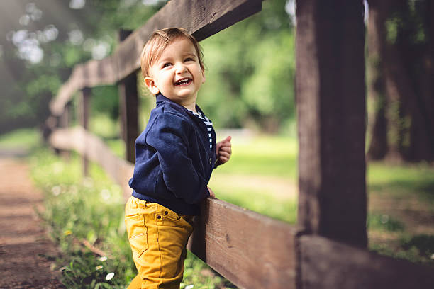 Portrait of cute baby boy laughing stock photo