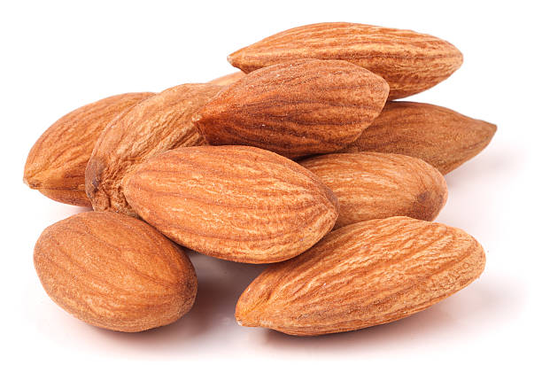 istock heap of almonds isolated on white background 522460640