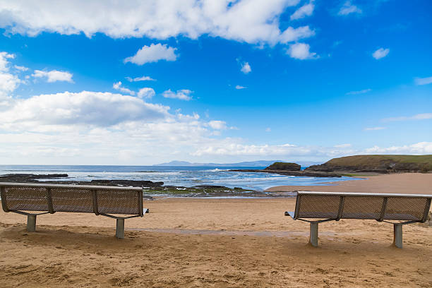 Bench and a sea view Bench and a sea view, location, Bundoran, co. Donegal, Ireland the beach and coastline around bundoran in donegal ireland stock pictures, royalty-free photos & images