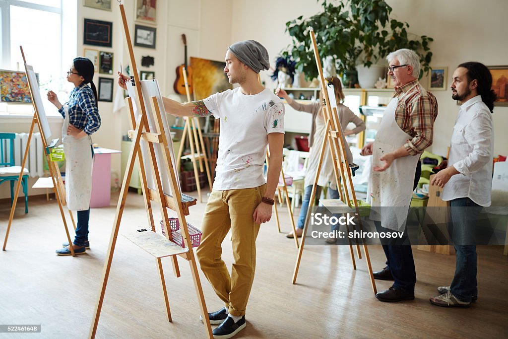 Students in workshop Group of creative students painting in workshop Painting - Activity Stock Photo