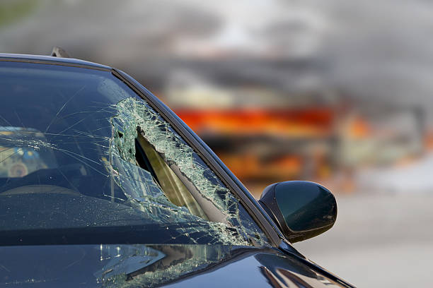 istock Broken windscreen at black car in traffic accident 522462274