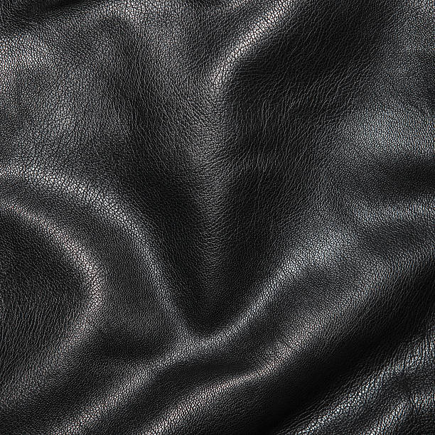 istock Black leather background in the folds 522462640