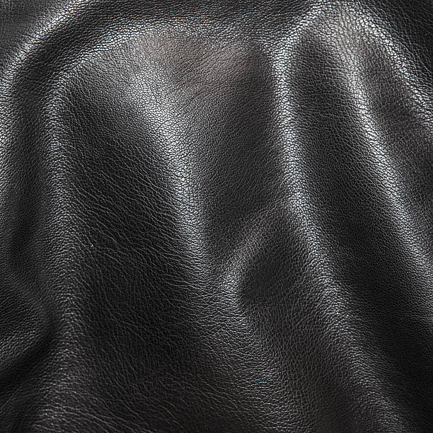 istock Black leather background in the folds 522462794