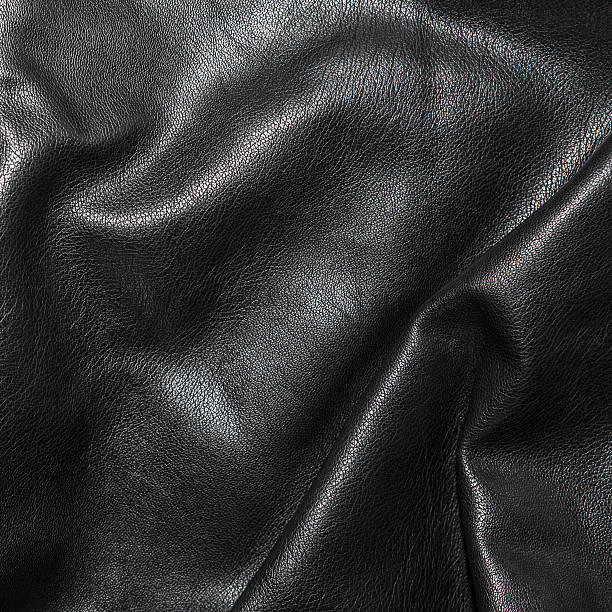 istock Black leather background in the folds 522462966
