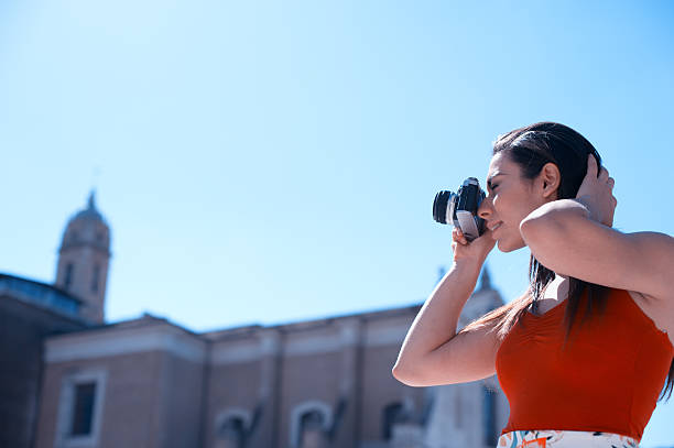 istock Young woman taking pictures in Rome 522463630