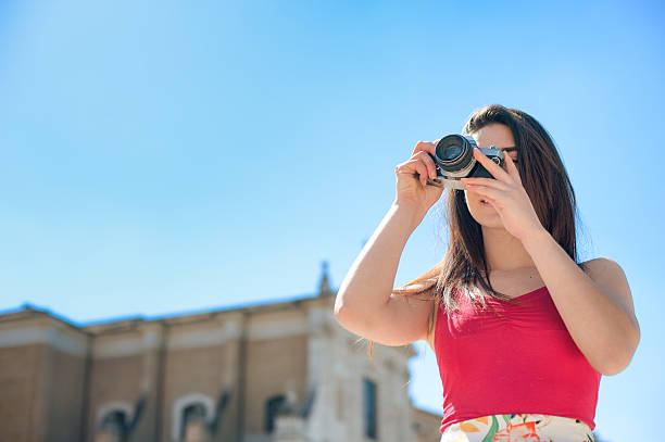 istock Young woman taking pictures in Rome 522463676