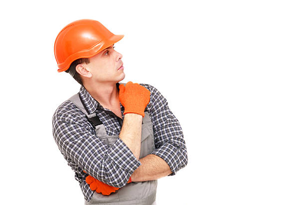 istock Builder in the construction overalls and helmet 522464426