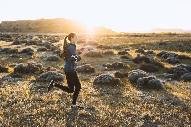 istock Young woman jogging on a sunny day 522464850