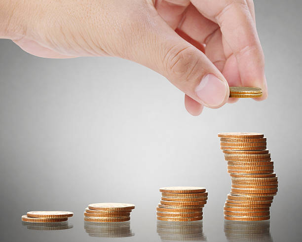 istock Hand human hand putting coin to money 522465066